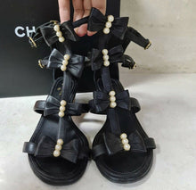 Load image into Gallery viewer, Chanel Camellia Pearl Black Leather Heels Sandals Size 37,5 - LuxyBrand
