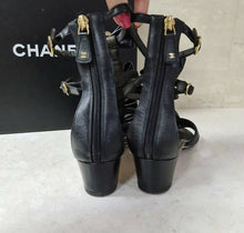 Load image into Gallery viewer, Chanel Camellia Pearl Black Leather Heels Sandals Size 37,5 - LuxyBrand
